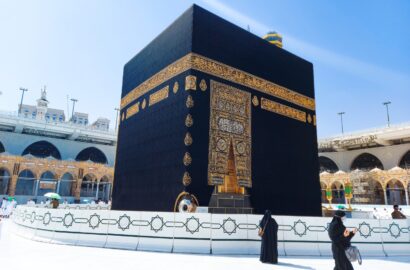 MECCA, SAUDI ARABIA , OCTOBER 22, 2020 - Pilgrims circle the Kaaba at Masjid al-Haram - umrah Fewer Muslims people Socially Distanced corona virus wearing face mask